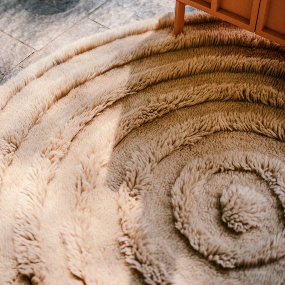 round woollen rug with concentric ring design