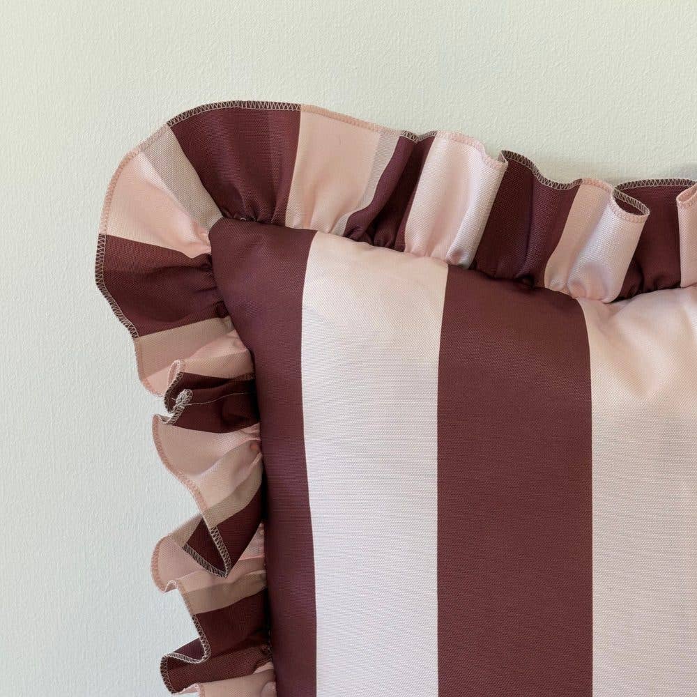 Striped fabric with red and pink colors on a light background