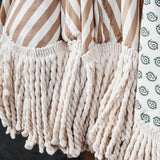 detail of tassels on garden umbrella