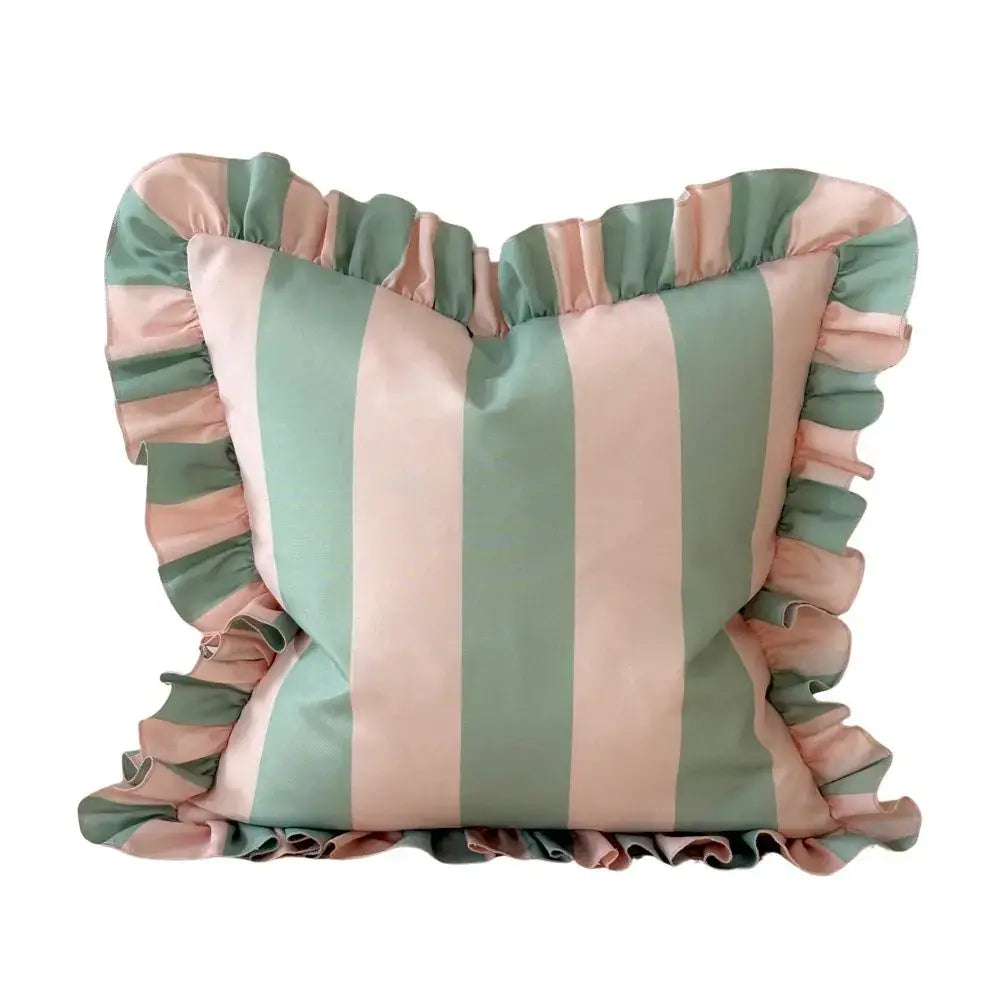 Striped cushion with ruffled edges in pink and green on a white background