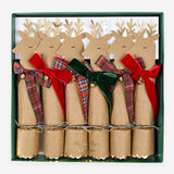 A set of six Christmas cracker ornaments in a dark green gift box. Each cracker is shaped like a reindeer with a brown kraft paper body, gold glitter antlers, and a ribbon bow in red, green, or plaid.