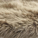 detail of taupe coloured sheepskin rug