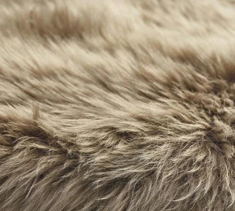 detail of taupe coloured sheepskin rug
