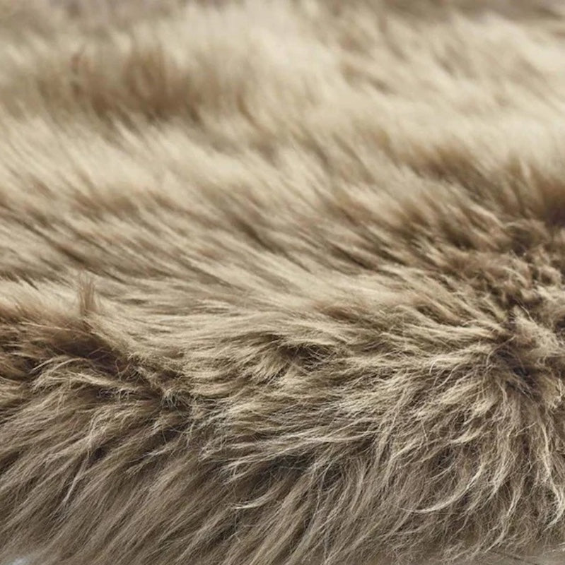 detail of taupe coloured sheepskin rug