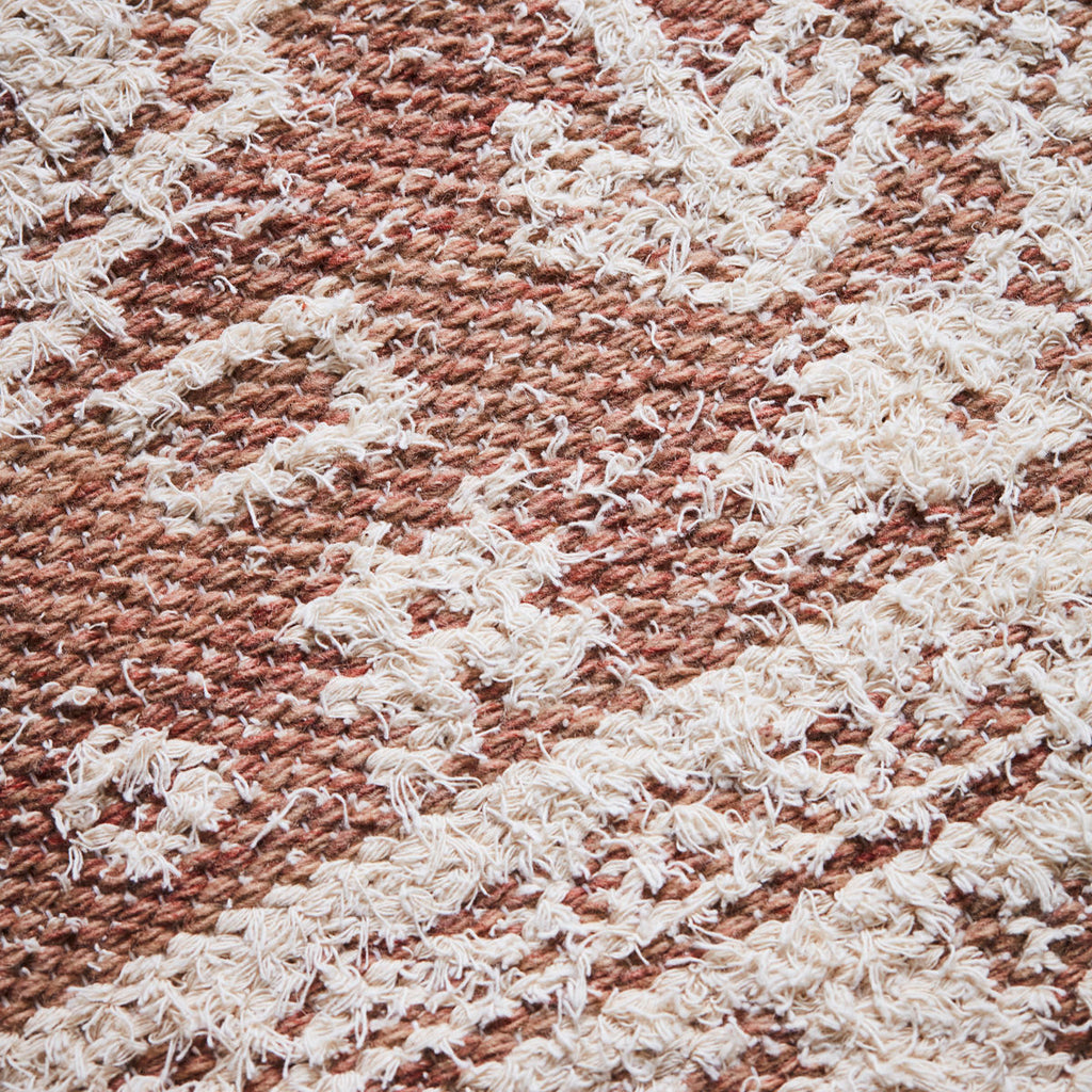 woven soft pink rug 