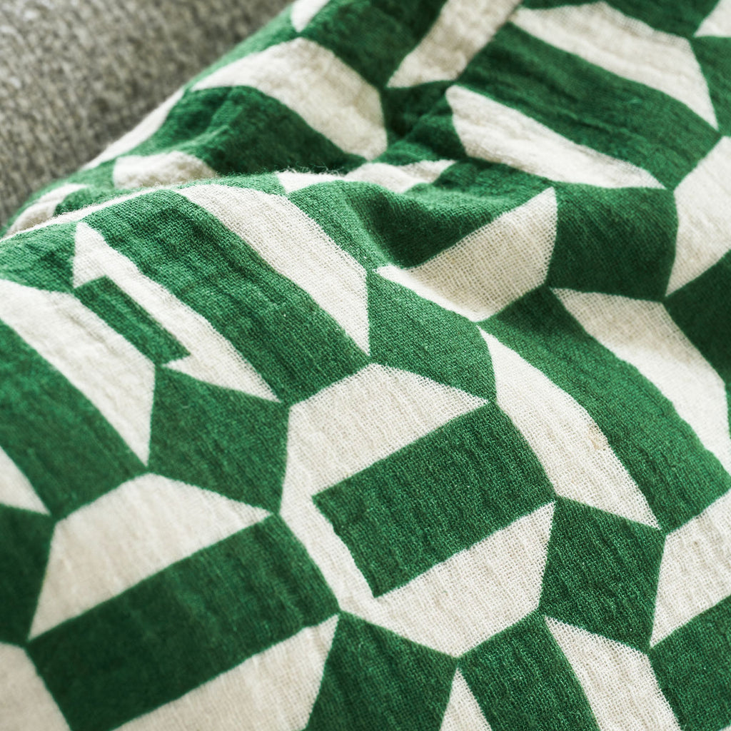 detail of green geometric cushion Etha by House Doctor