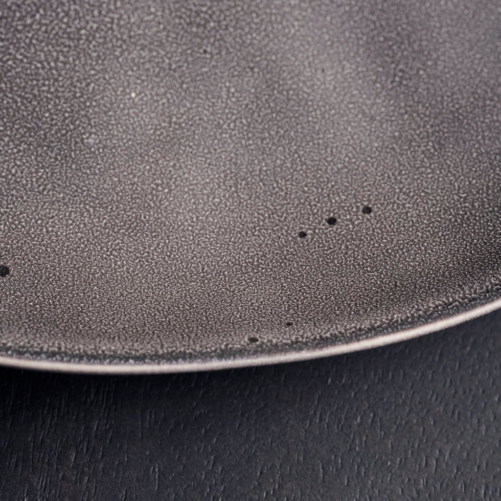 Detail of Dark grey rustic stoneware plate by House Doctor