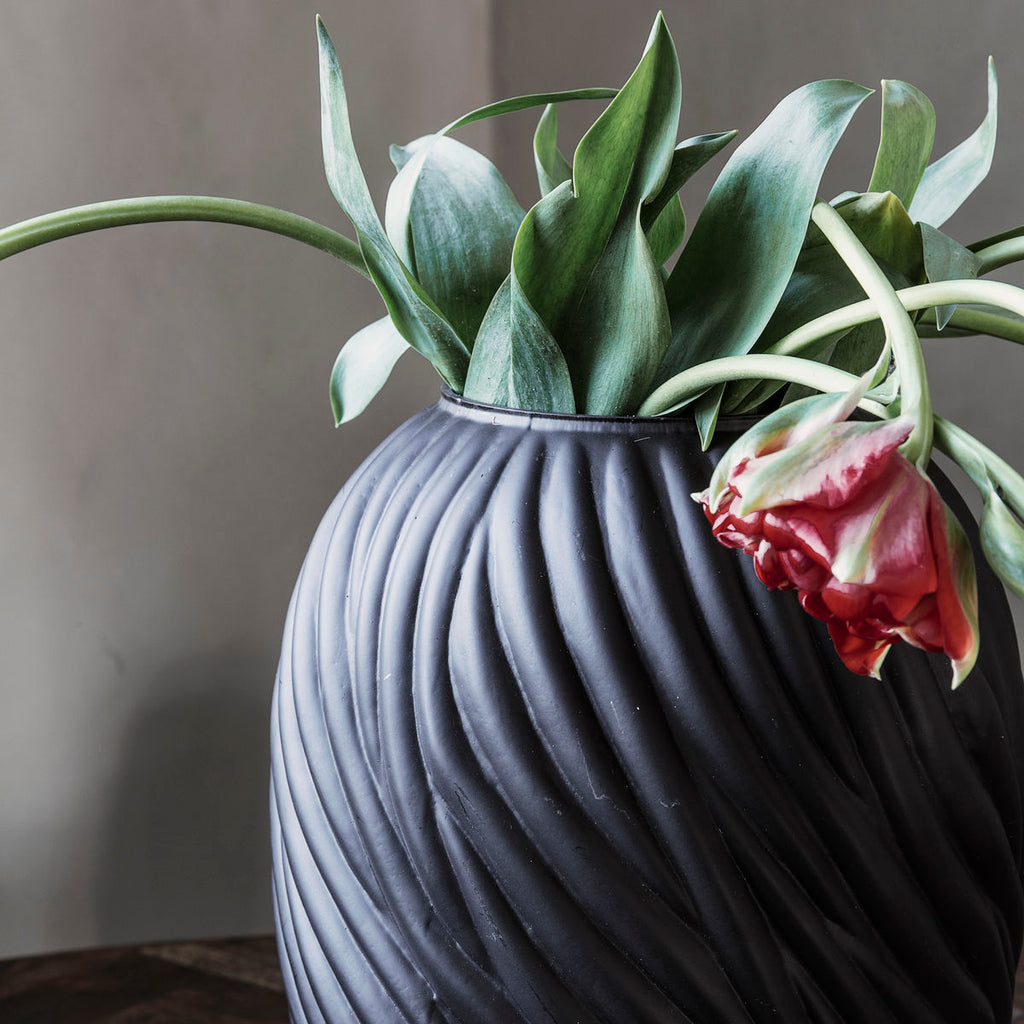 dark brown glass vase with a swirl texture 