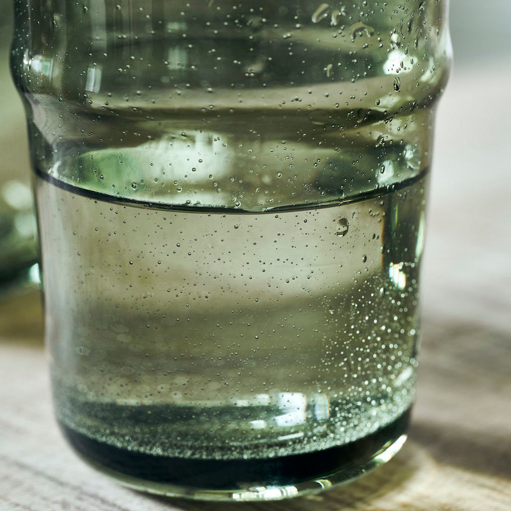 detail of air bubbles on green drinking glasses