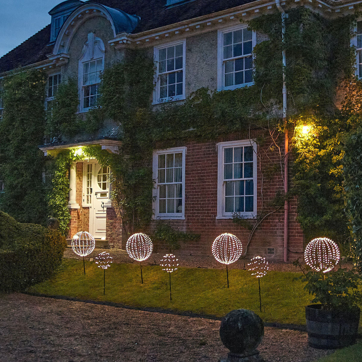 illuminated led sphere lights outside a house