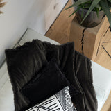 dark grey velvet throw with fringed edges
