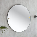 round mirror with brass bolts 