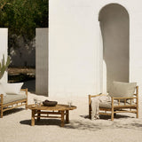 Bamboo armchair and coffee table in a gard