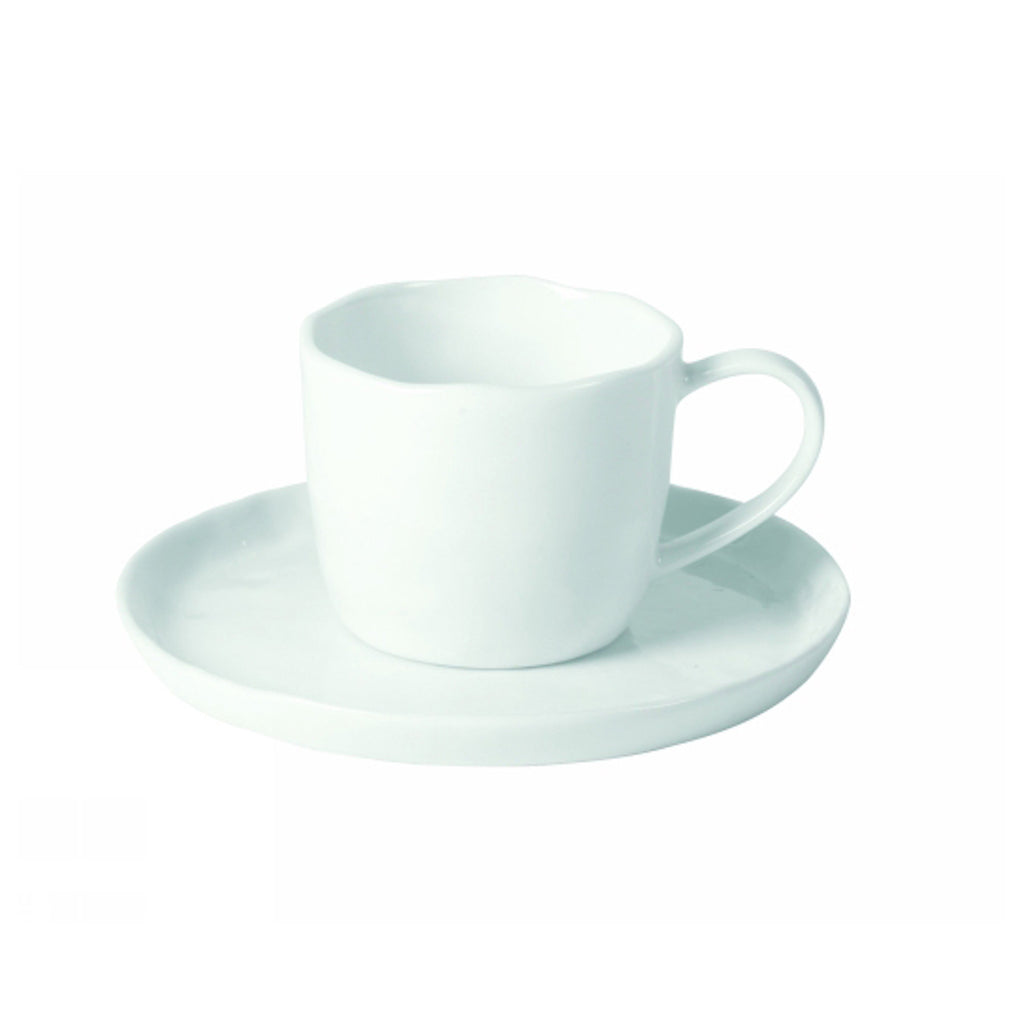 white porcelain teacup and saucer