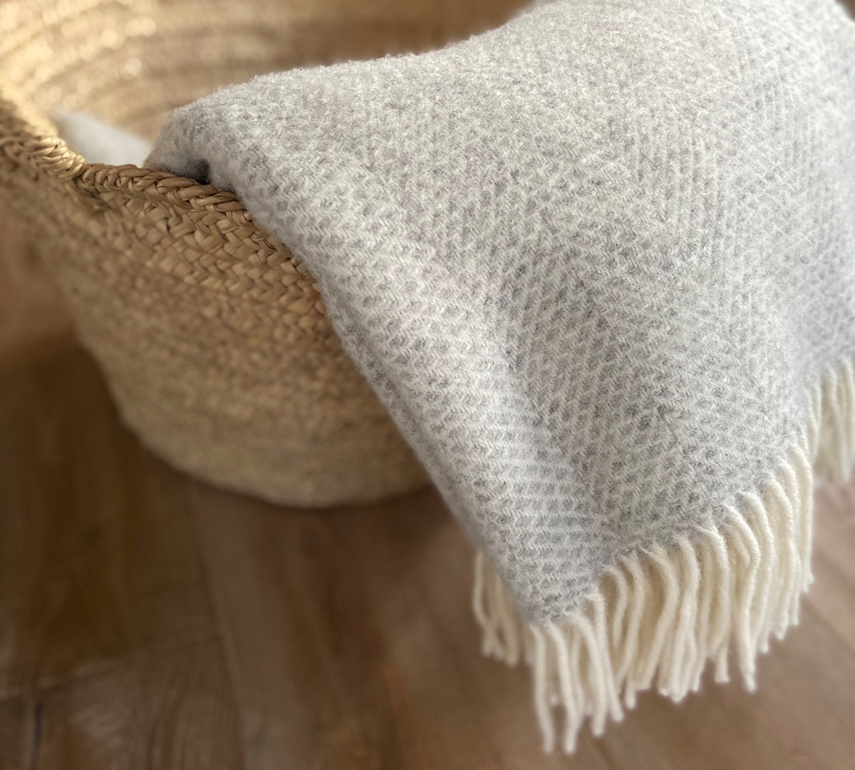 beehive pattern wool throw in grey and white by Tweedmill