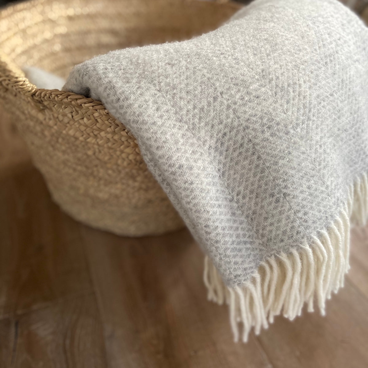 beehive pattern wool throw in grey and white by Tweedmill