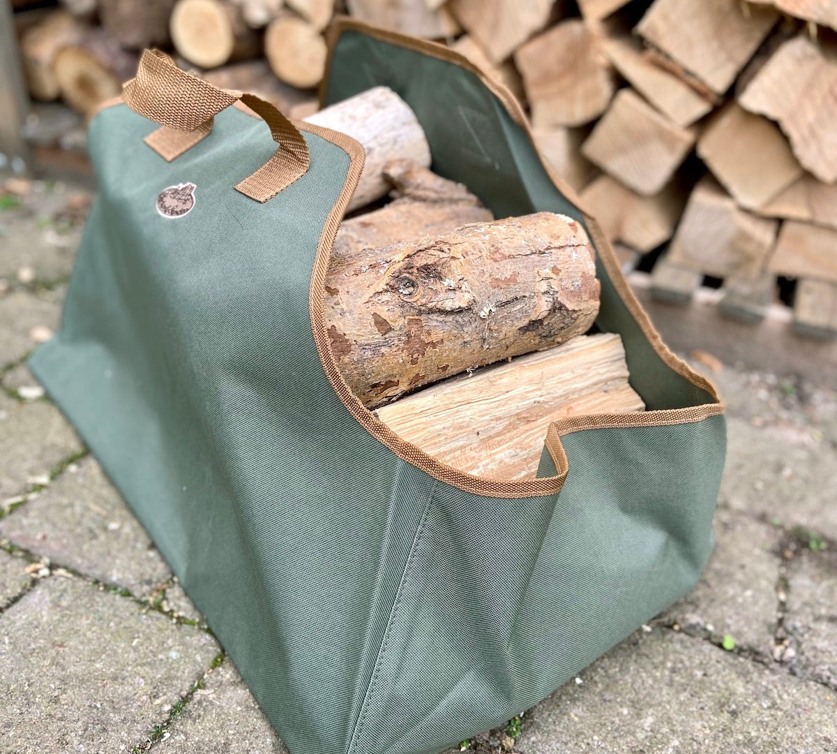 olive green log carrier by fallen fruits