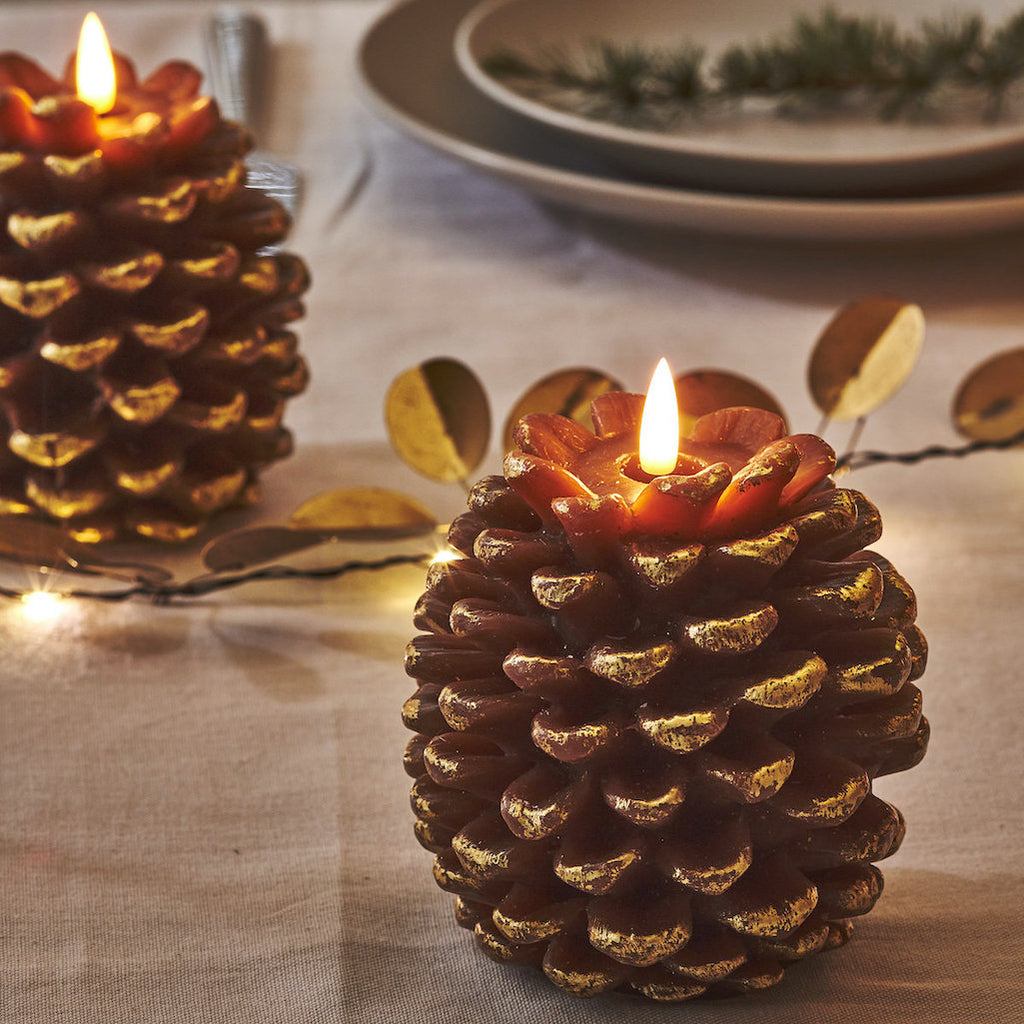 Pine cone shaped LED candle in gold 