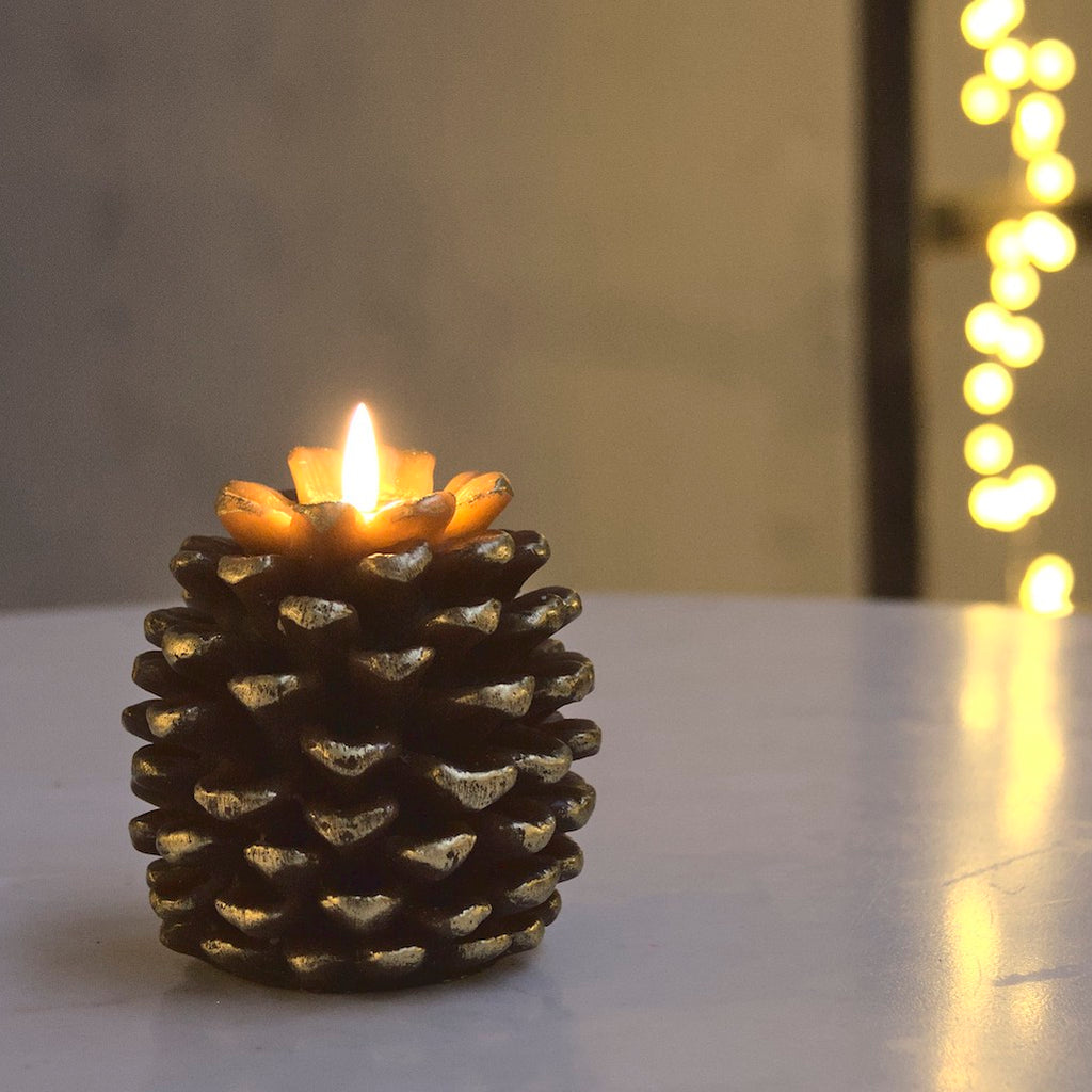 gold pinecone candle with LED flame