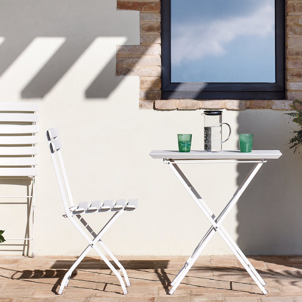White foldable outdoor chair and table by Nordium