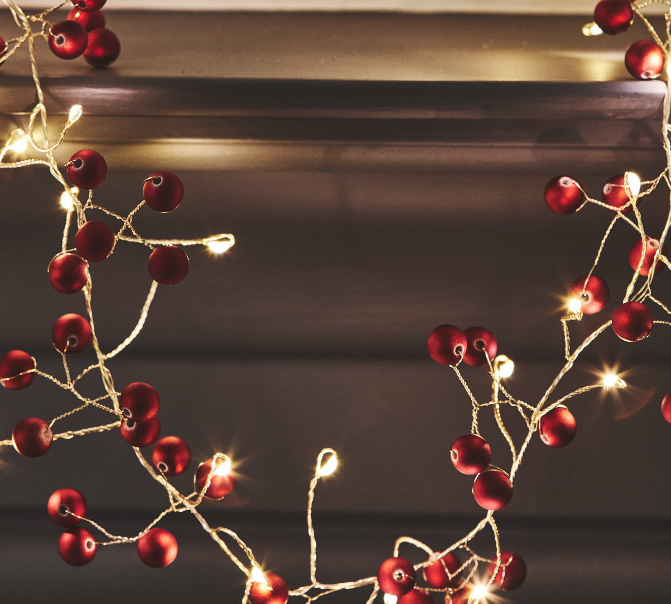 red berry string light with small white lights 