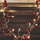 red berry string light with small white lights 