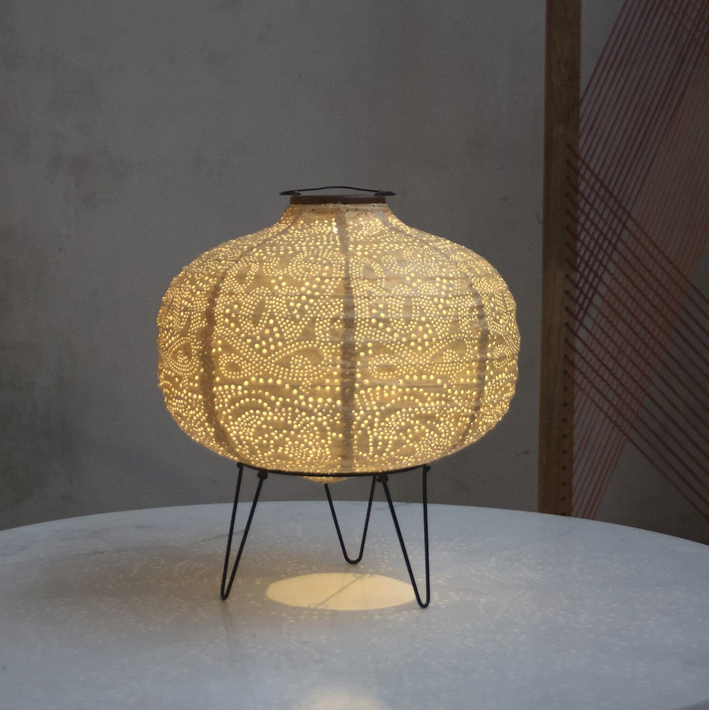 yellow pumpkin solar light on table