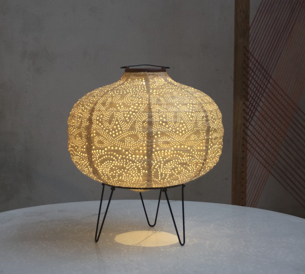 yellow pumpkin solar light on table