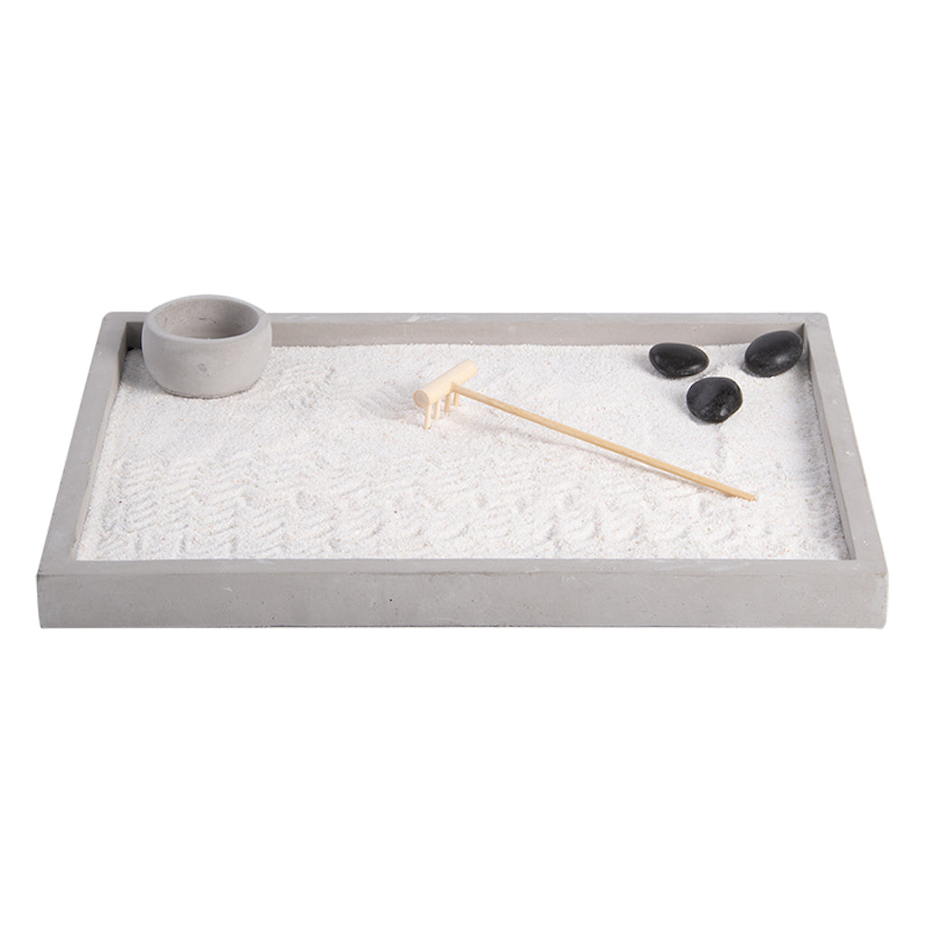 zen garden set with sand, rake and pebbles