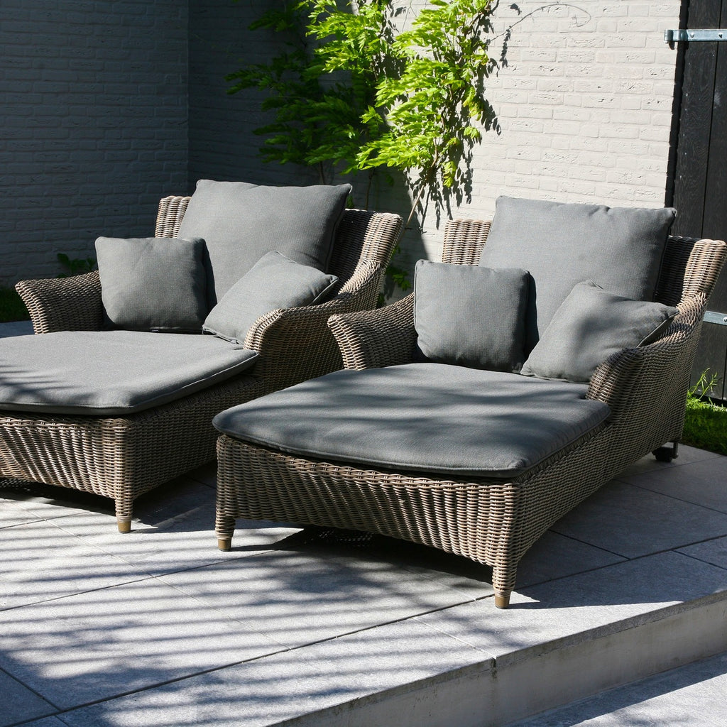 rattan sun lounger with dark grey cushions 