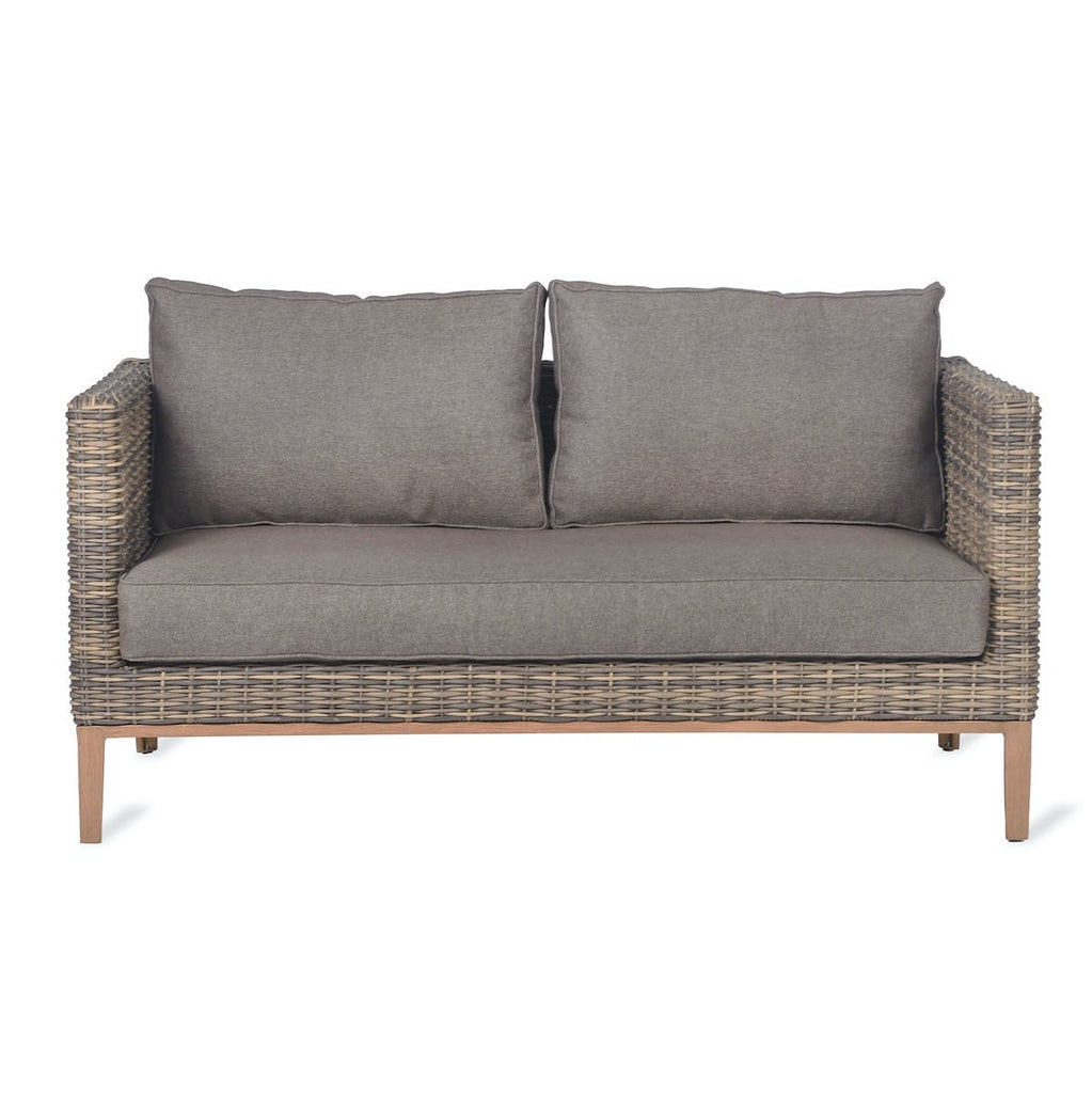 walderton rattan garden sofa with soft fawn cushions