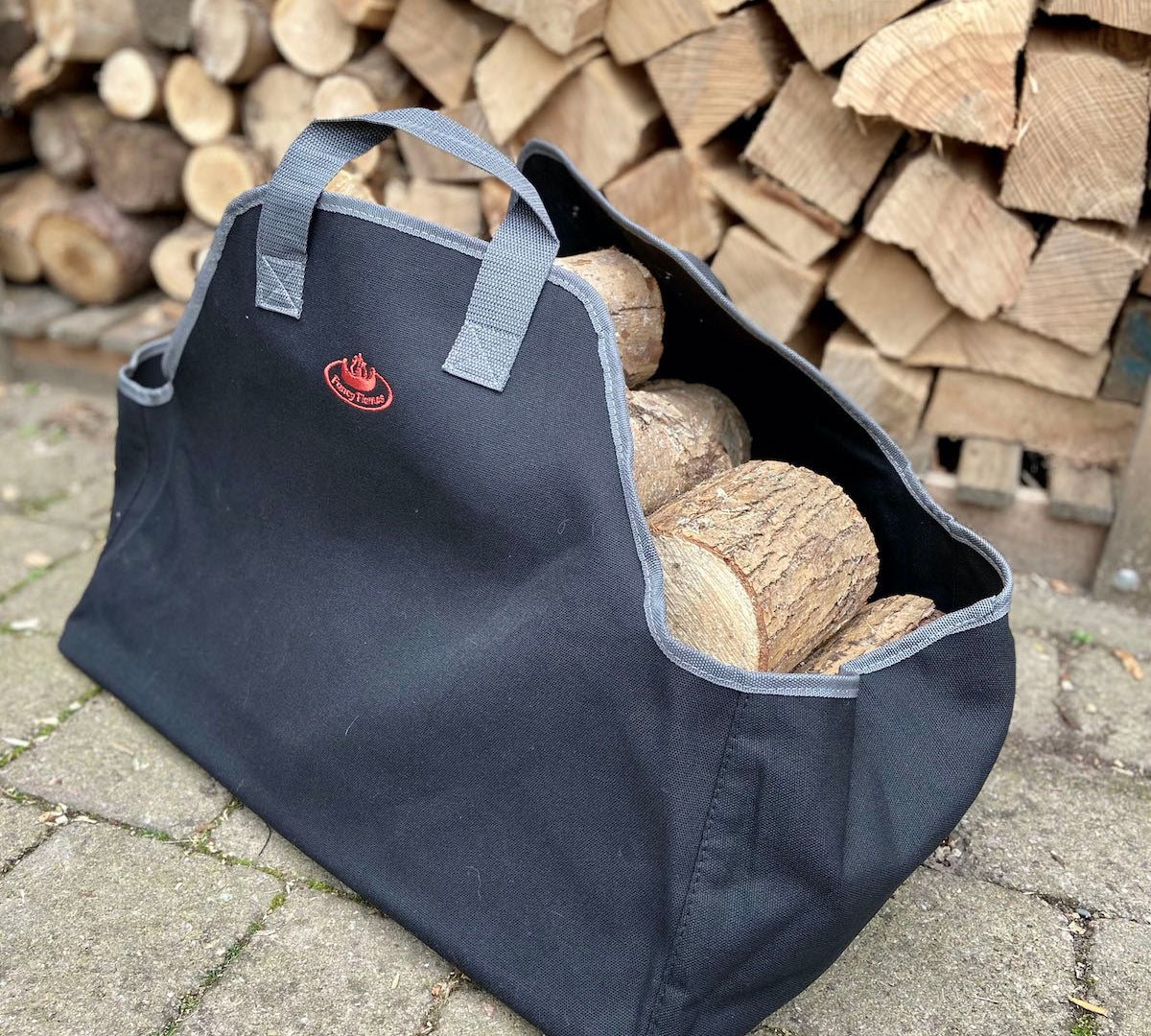 black canvas log carrier by fallen fruits