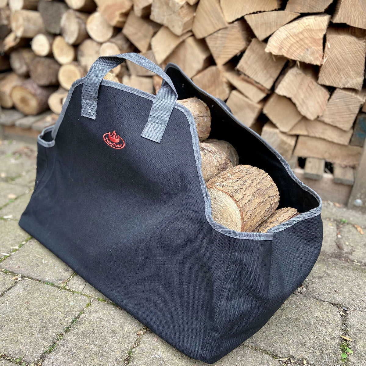 black canvas log carrier by fallen fruits