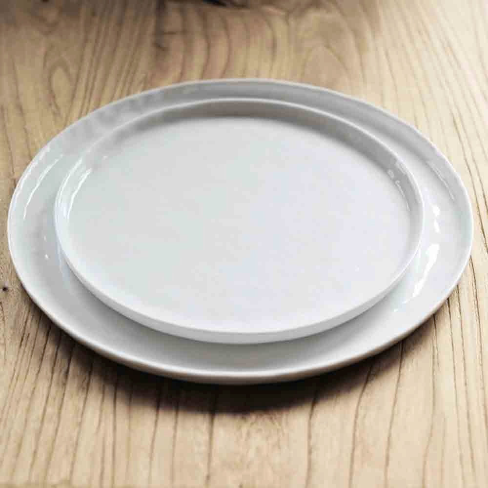 white plates with a rustic mottled finish 