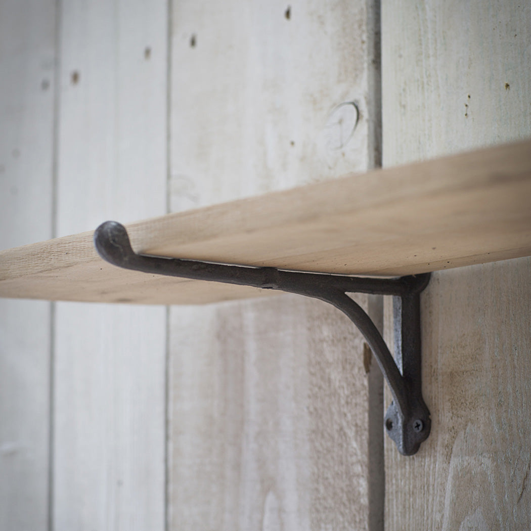 oak shelf with iron brackets