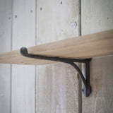 oak shelf with iron brackets