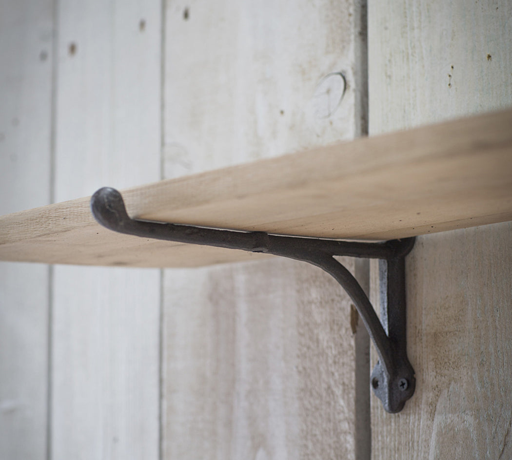 oak shelf with iron brackets
