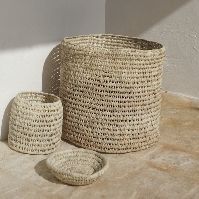 woven palm leaf storage basket by Tine K home